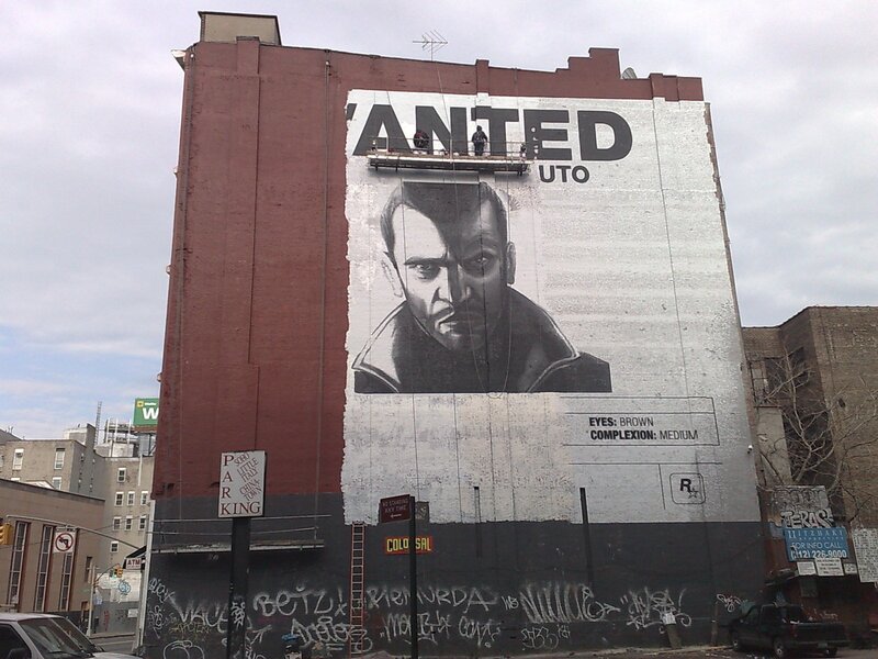 Wanted poster mural on building