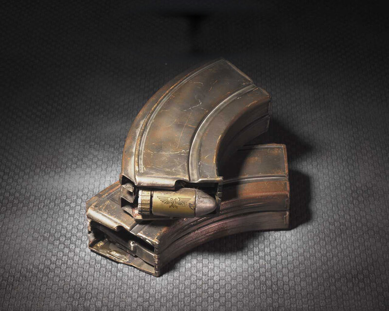 War-torn magazine with bullet