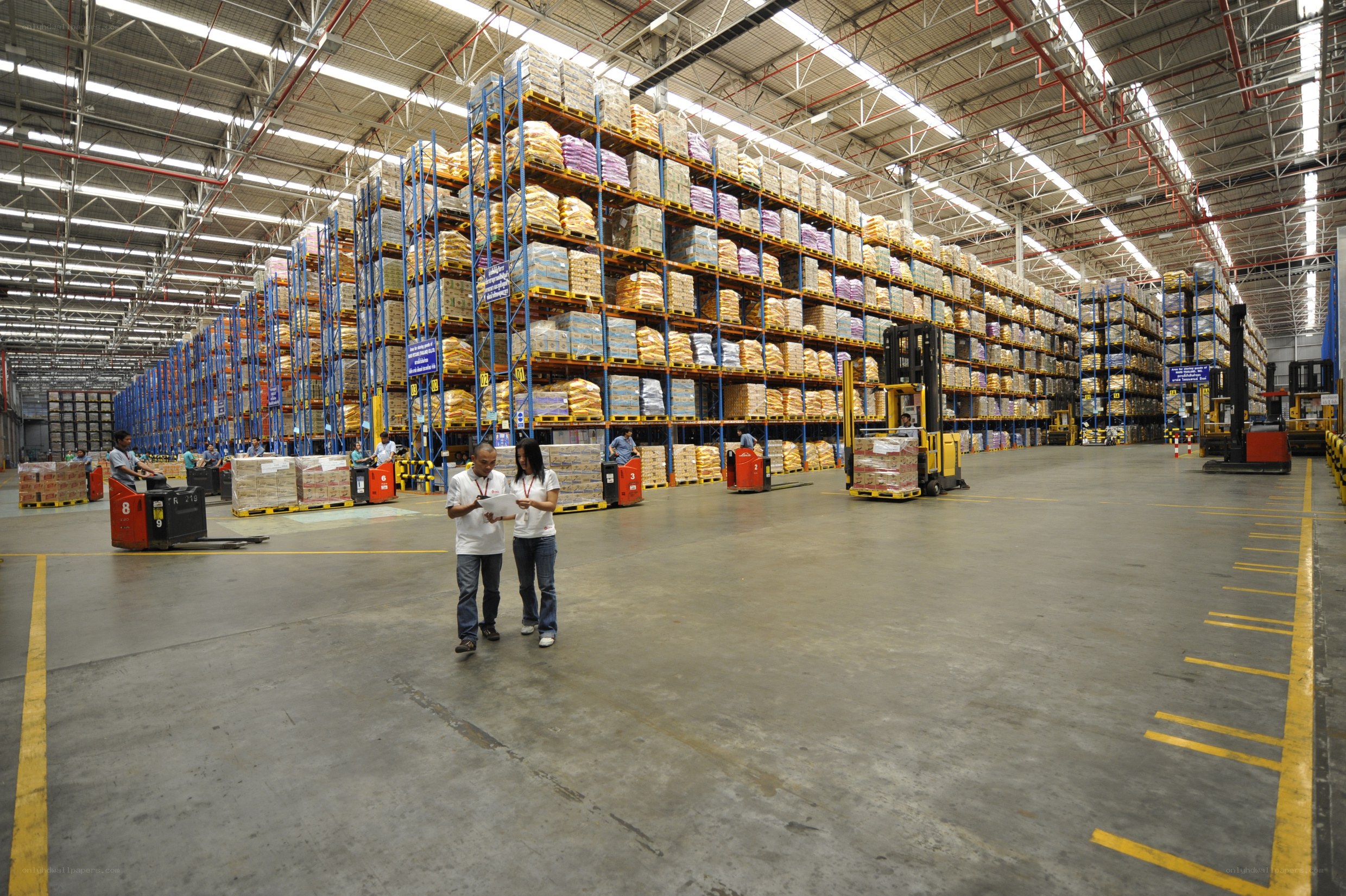 Warehouse workers in a large distribution center