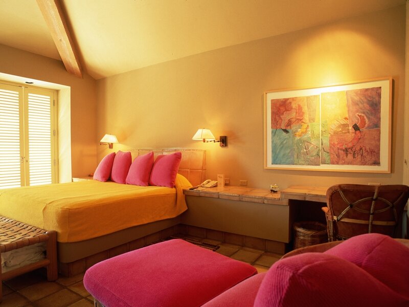 Warm hotel room with colorful decor