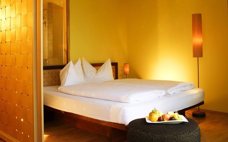 Warm hotel room with fruit platter