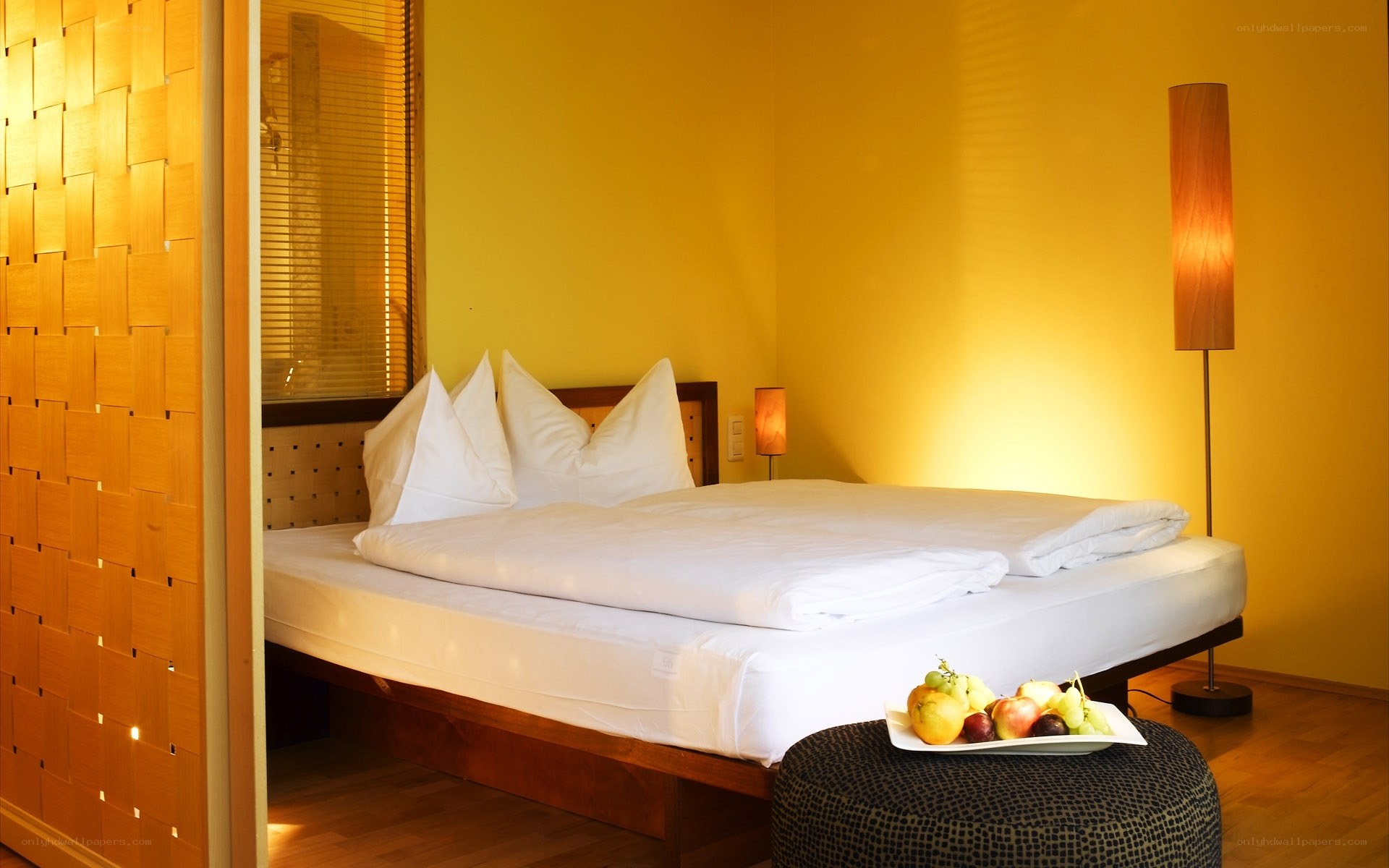 Warm hotel room with fruit platter