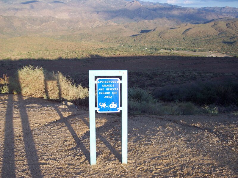 Warning sign in desert landscape