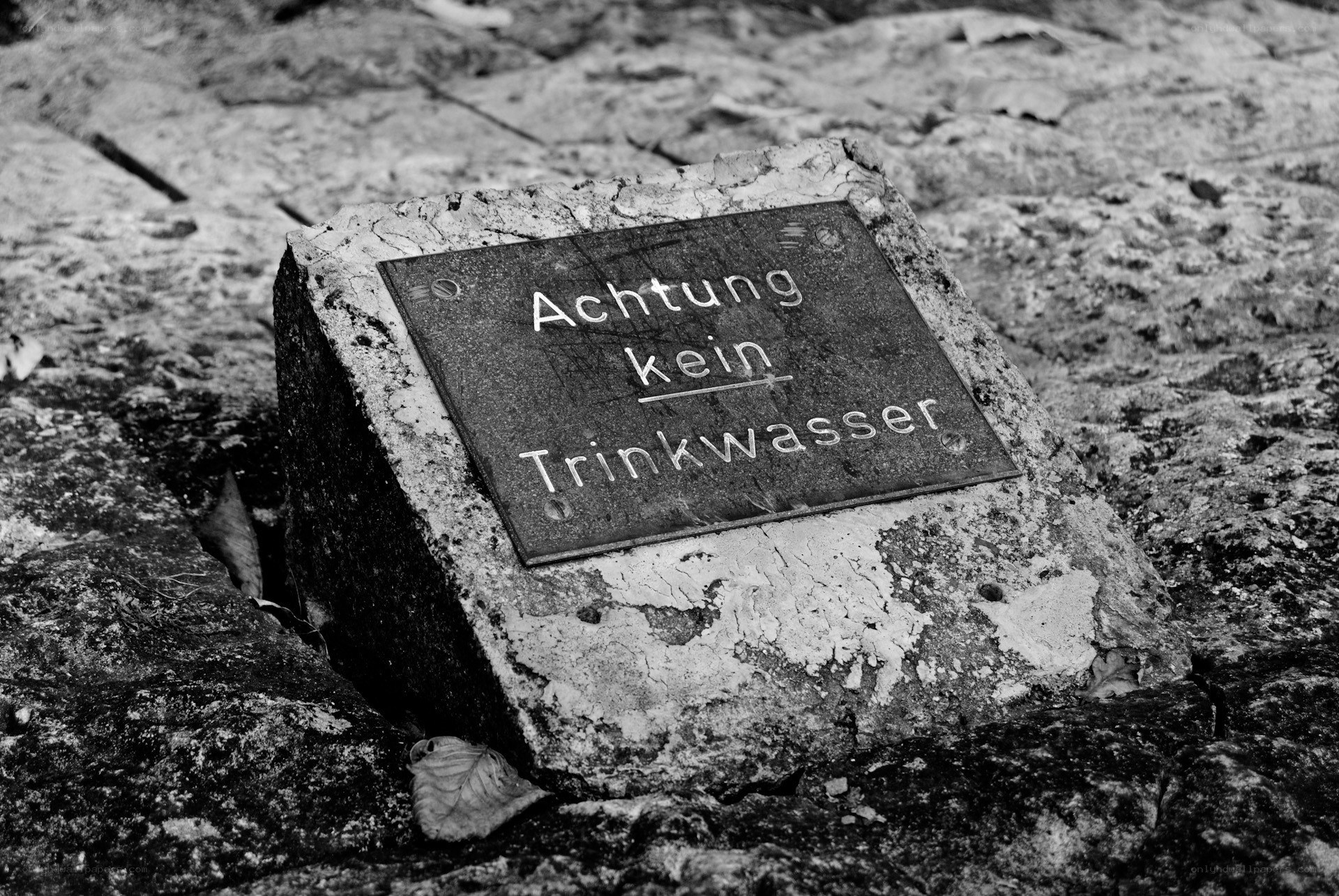 Warning sign on stone block
