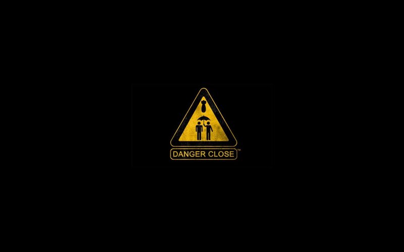 Warning Sign with Figures — Black, Dramatic