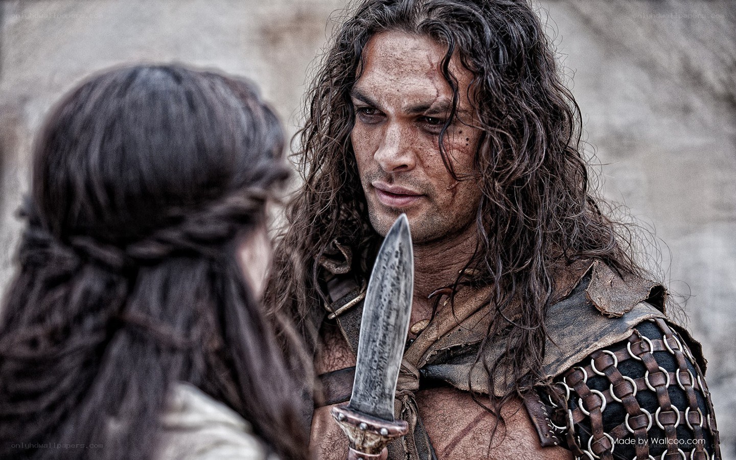 warrior with dagger facing woman