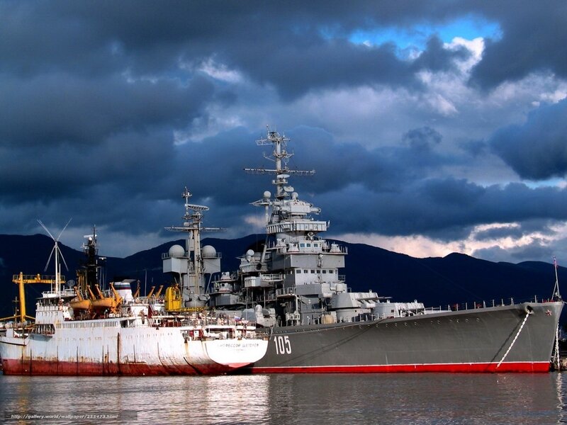 Warship in harbor under stormy sky