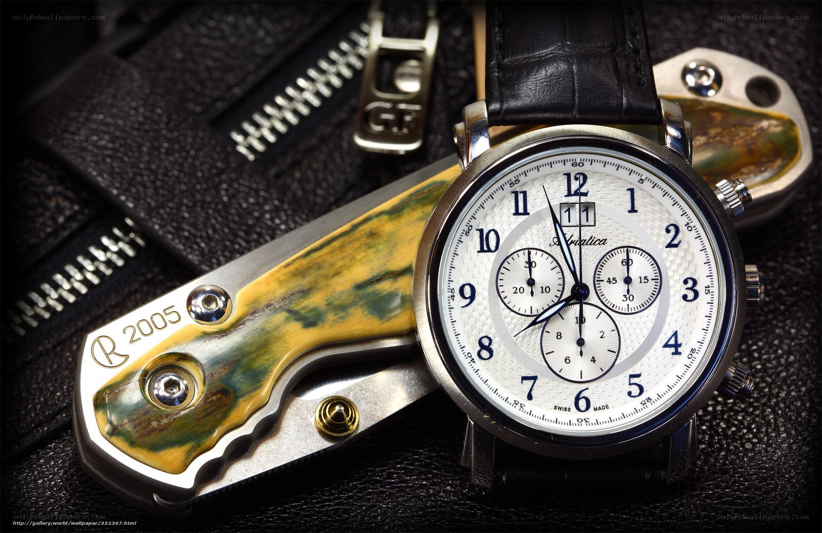 watch and knife on leather