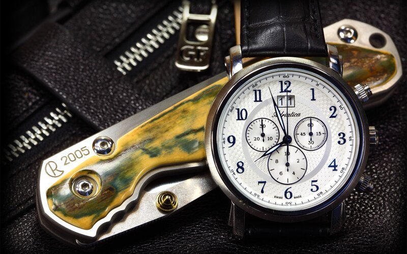 Watch and pocket knife on leather