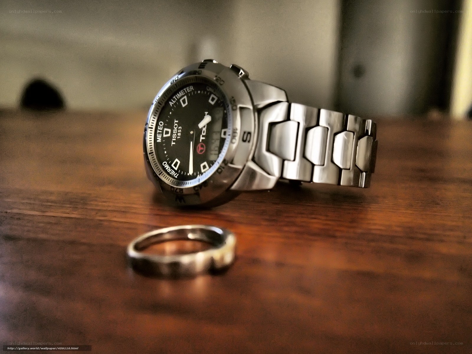 watch and ring on wood