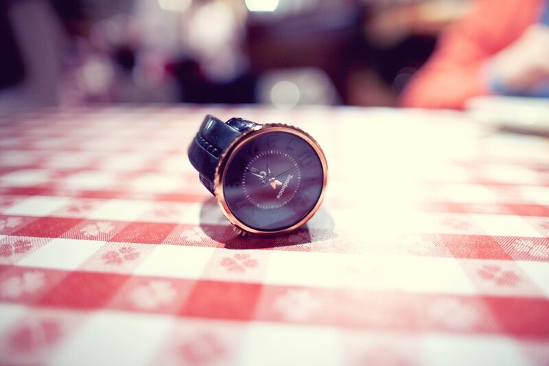 watch on checkered tablecloth