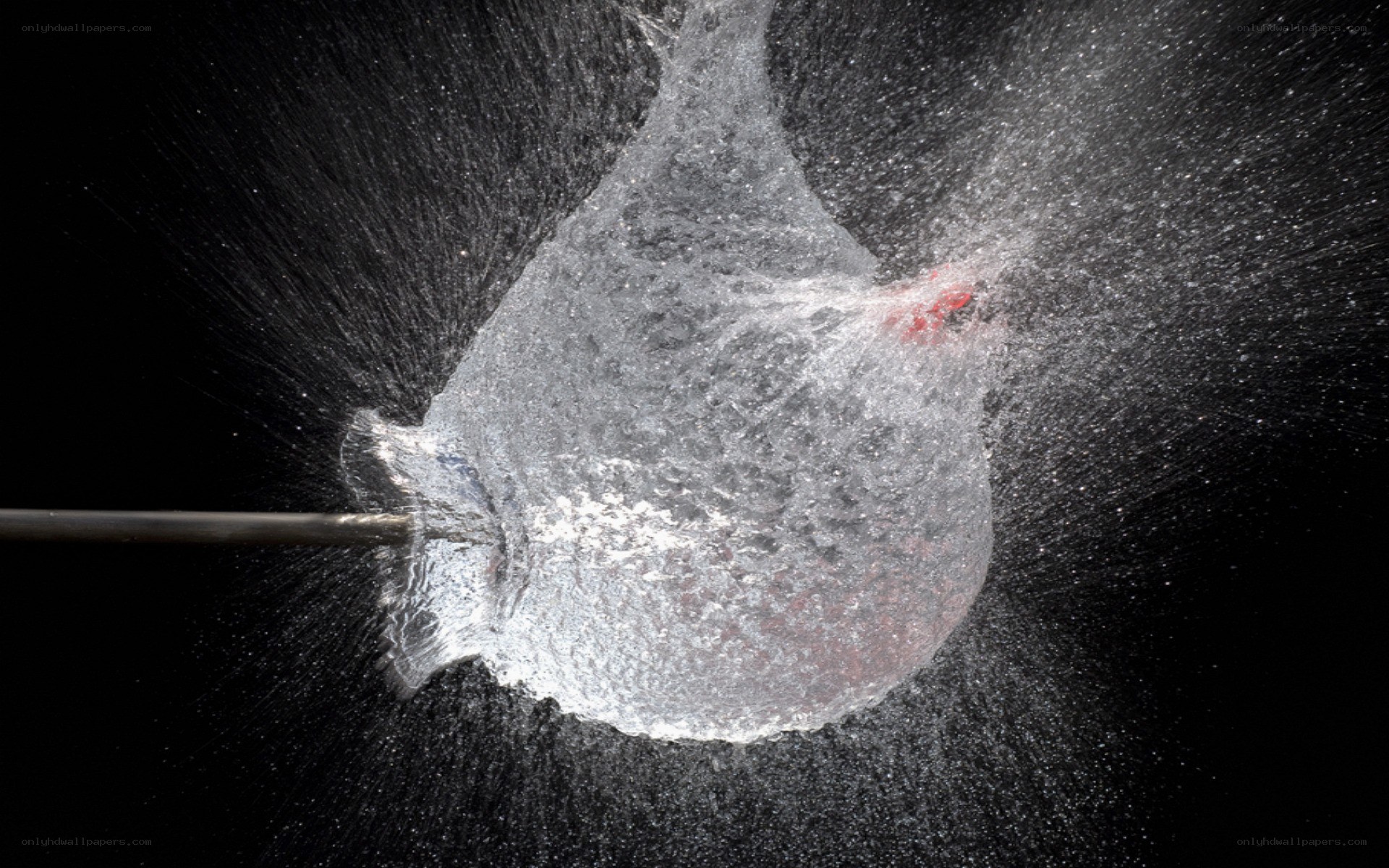 Water balloon bursting on impact