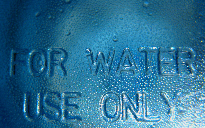 Water bottle with embossed text