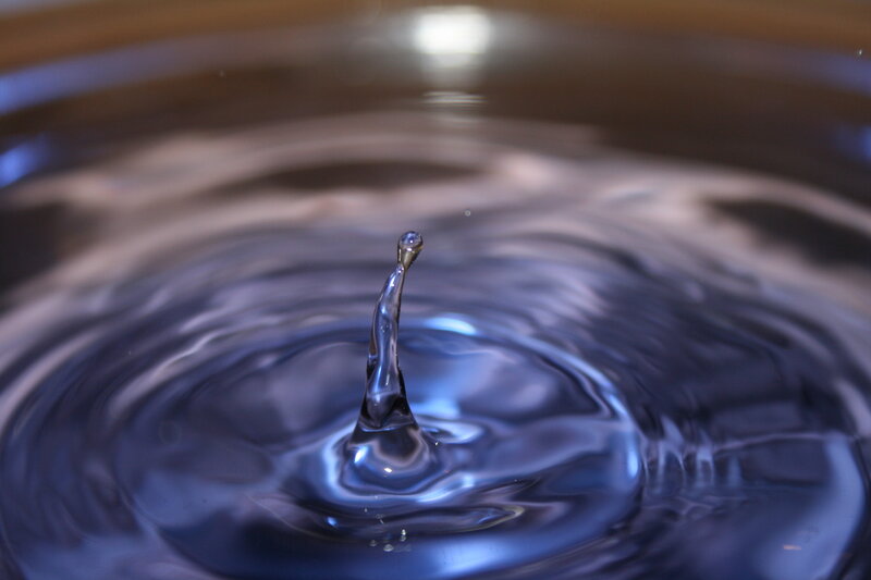 Water drop creating a splash