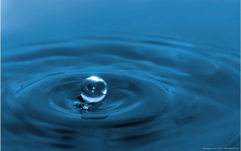 Water drop creating ripples