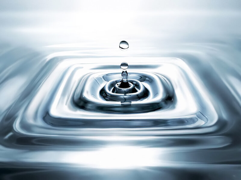 Water drop creating ripples