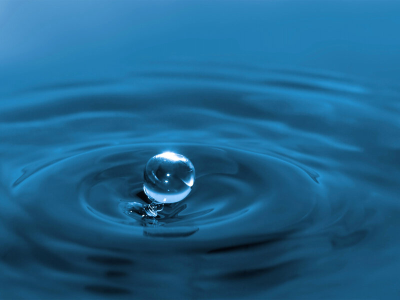 Water drop creating ripples