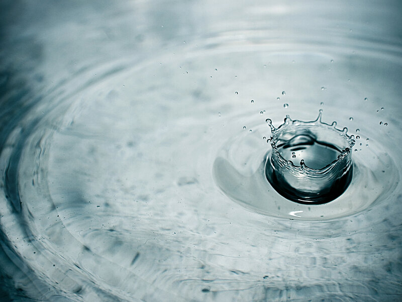 Water drop creating ripples