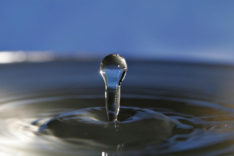 Water drop forming a column