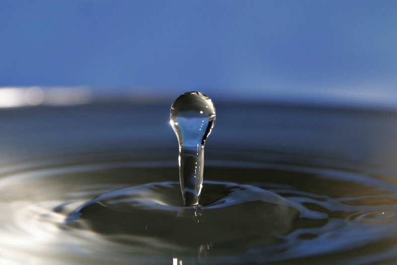 Water drop forming a column