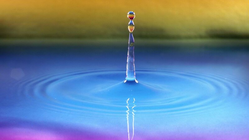 Water drop impact creating a column