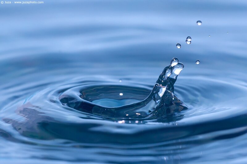 Water drop splash in blue