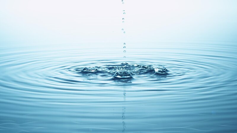 Water droplet creating ripples