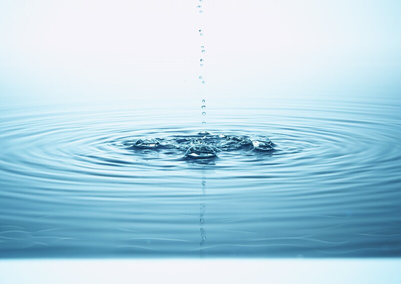 Water droplet creating ripples