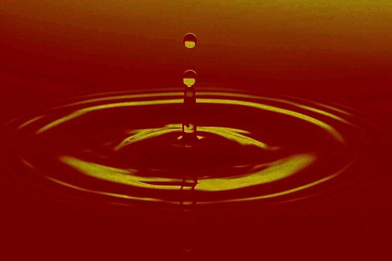 Water Droplet Creating Ripples — Red