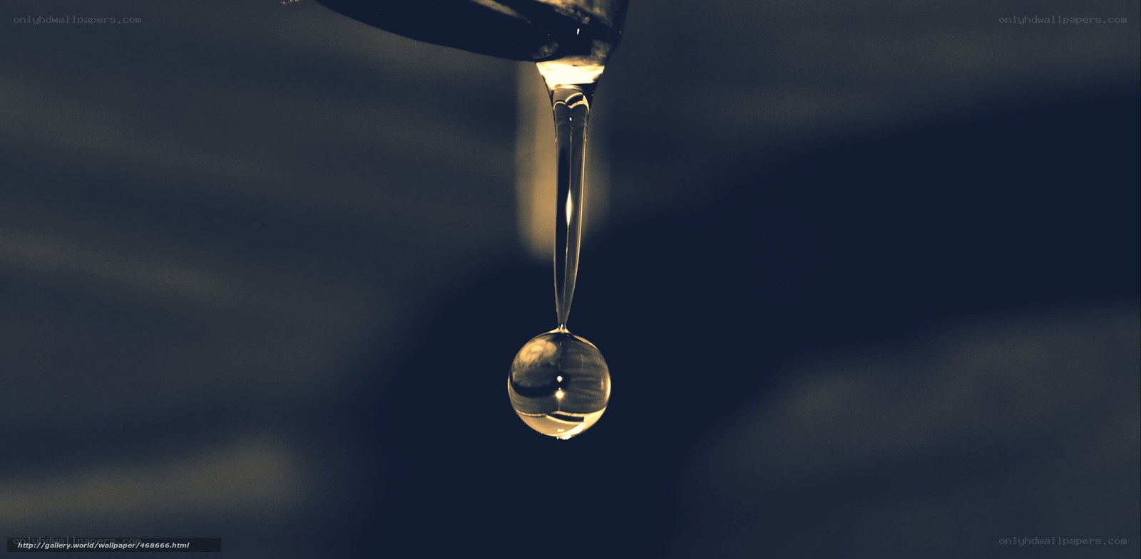 Water droplet falling from faucet