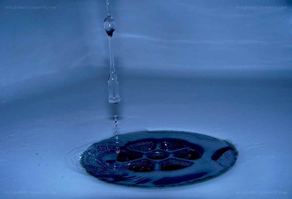 Water droplet falling into sink