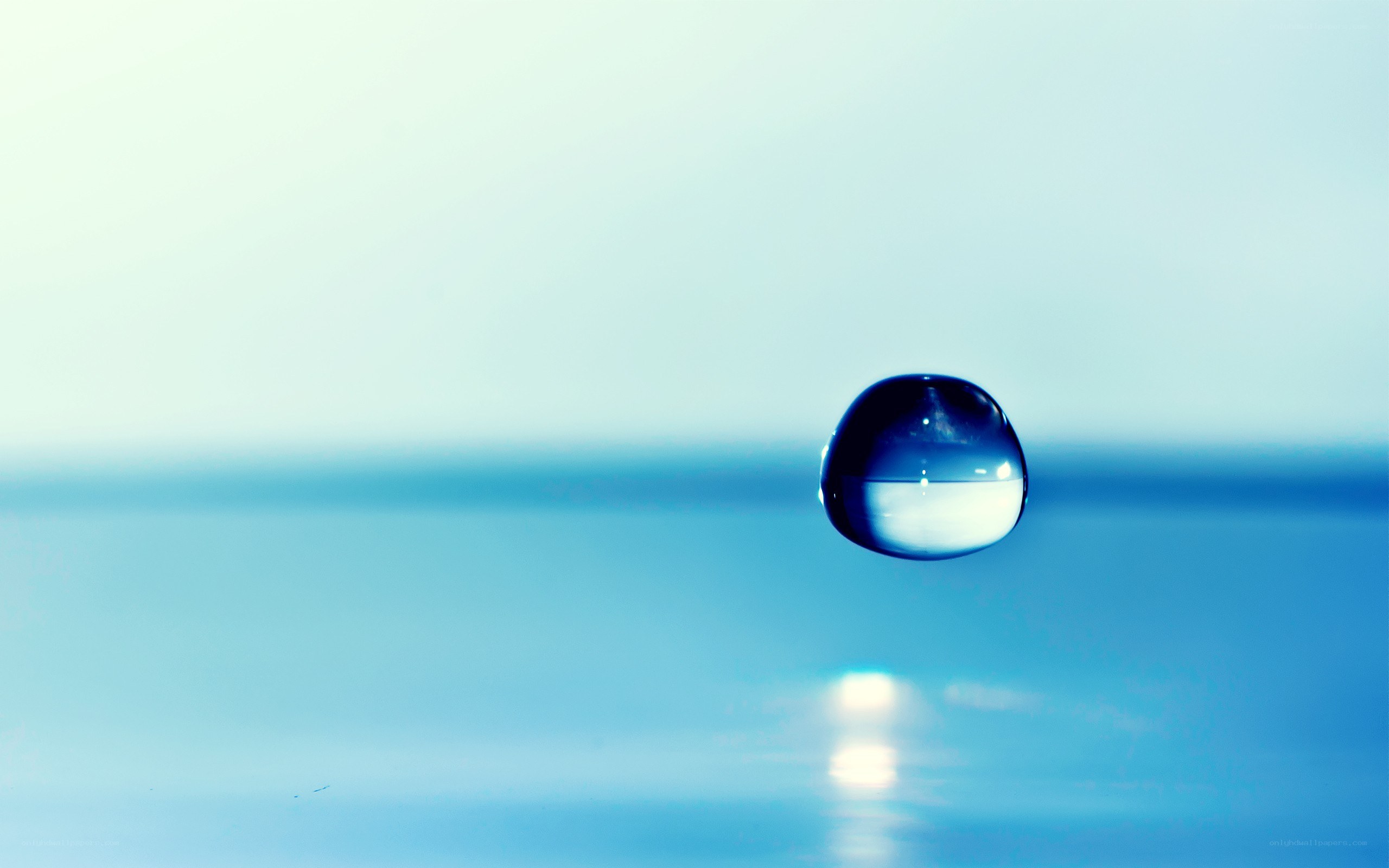 Water droplet on blue surface