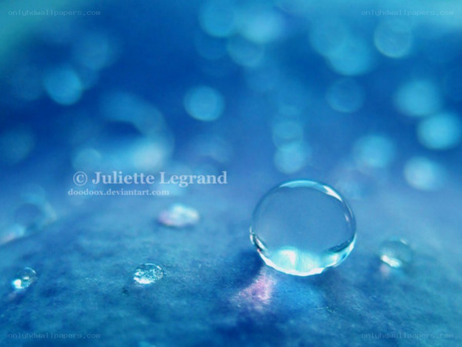 Water droplet on blue surface