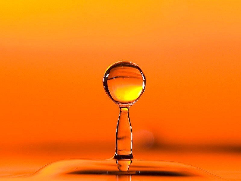 Water droplet on orange background
