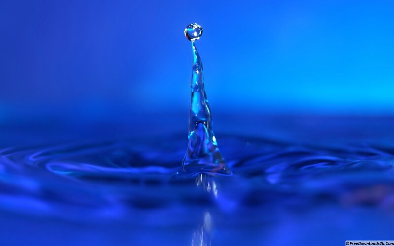 Water Droplet Splash — Blue Background