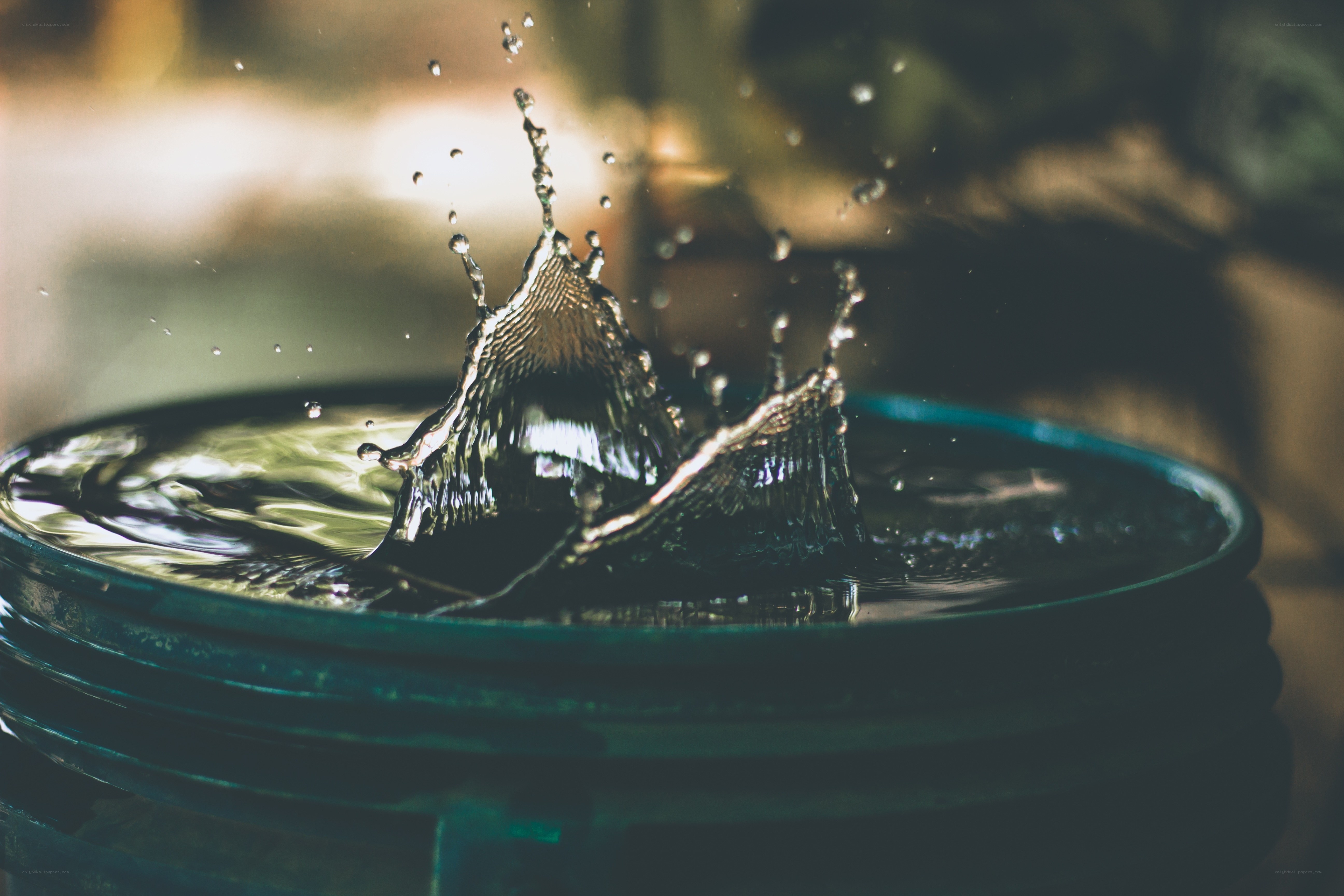 Water droplet splash in a bucket