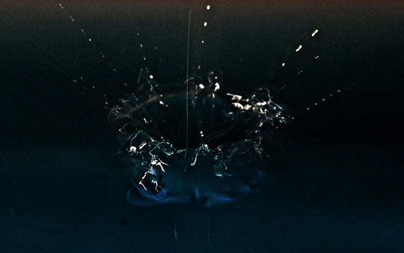 Water droplet splash in dark