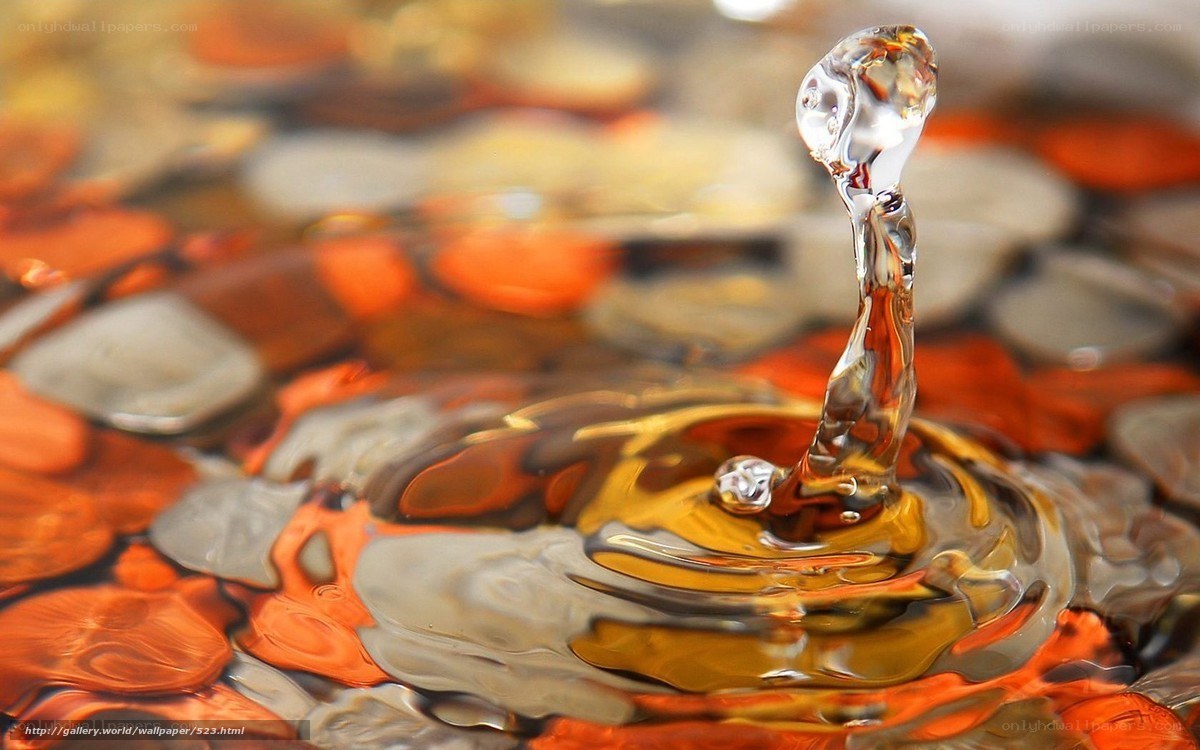 Water droplet splash on pebbles
