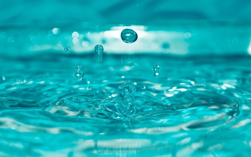 Water droplets creating ripples
