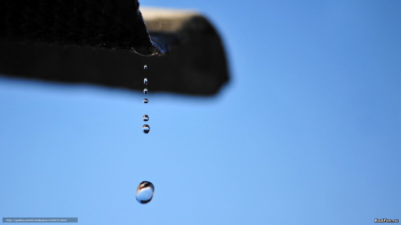 Water droplets falling from a pipe