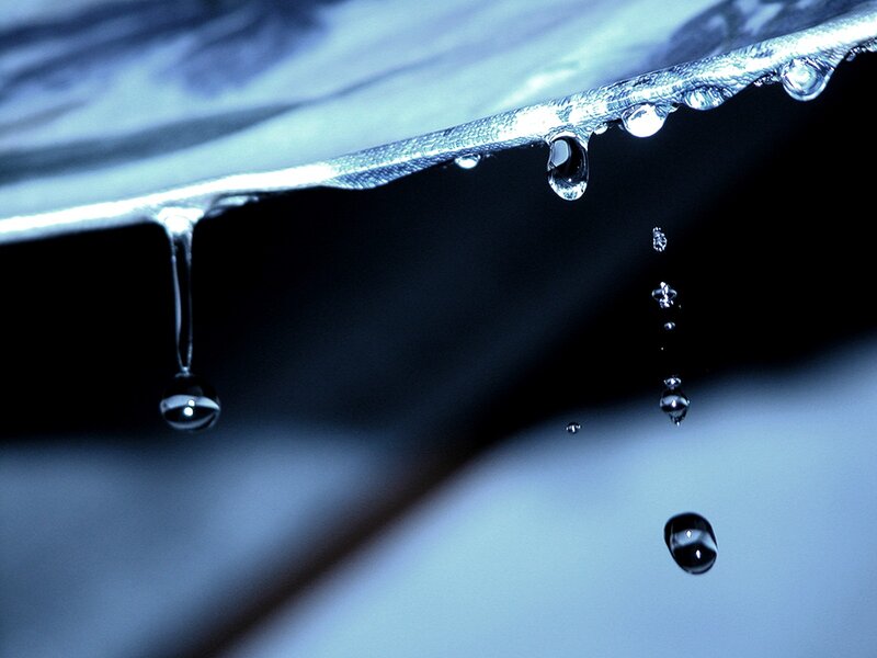 Water droplets falling from a surface