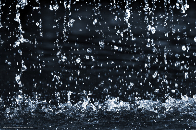 Water droplets falling in dark