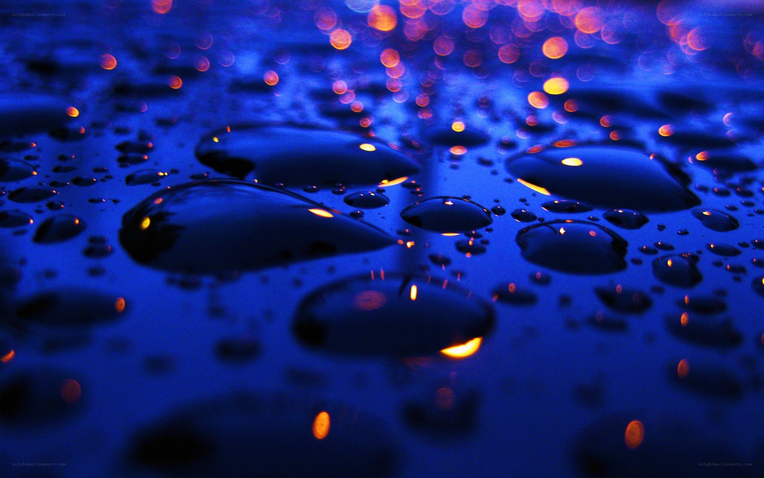 Water droplets on a blue surface