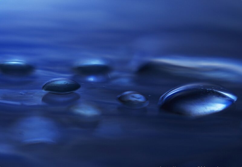 Water droplets on a blue surface