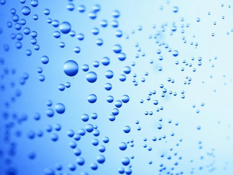 Water droplets on a blue surface