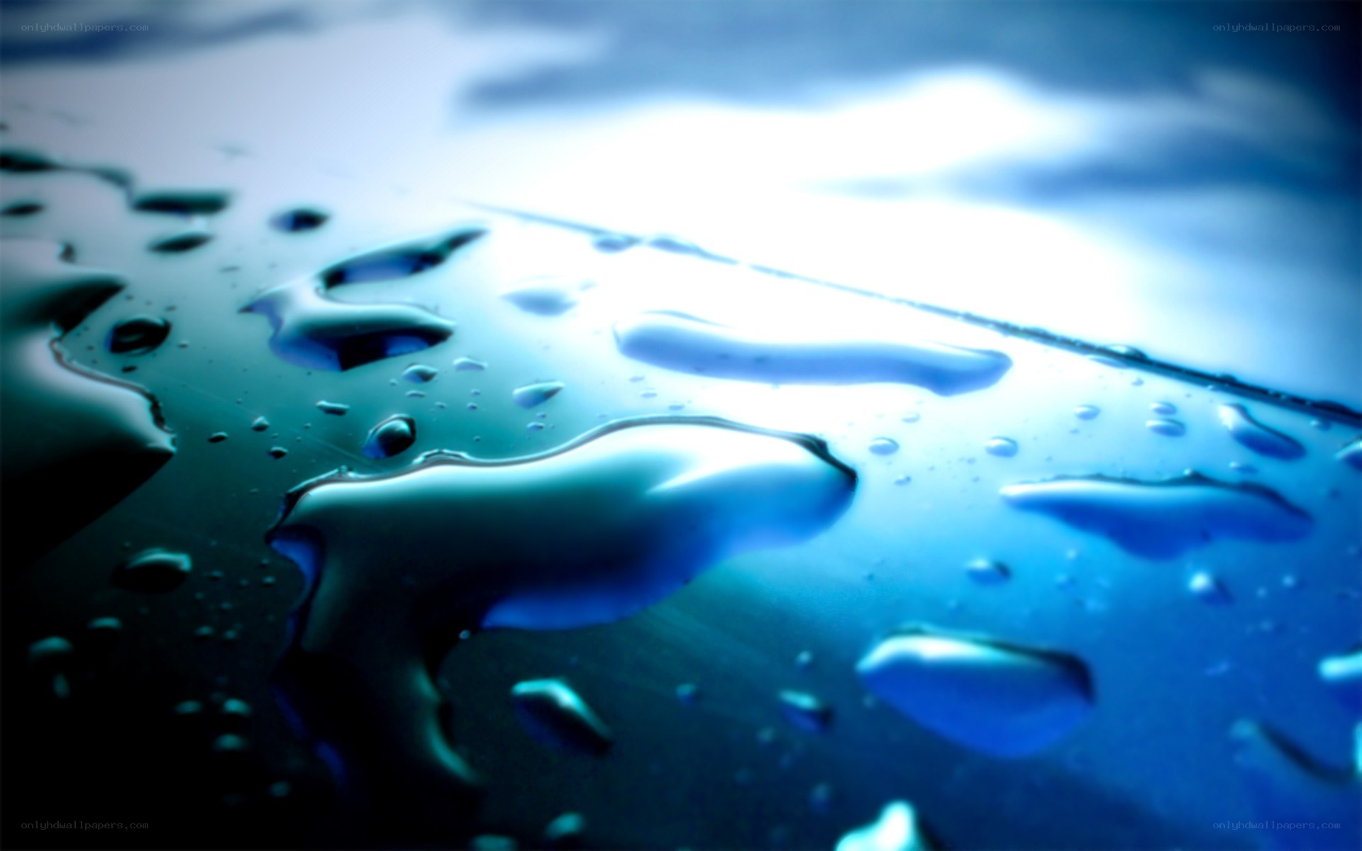 Water droplets on a blue surface