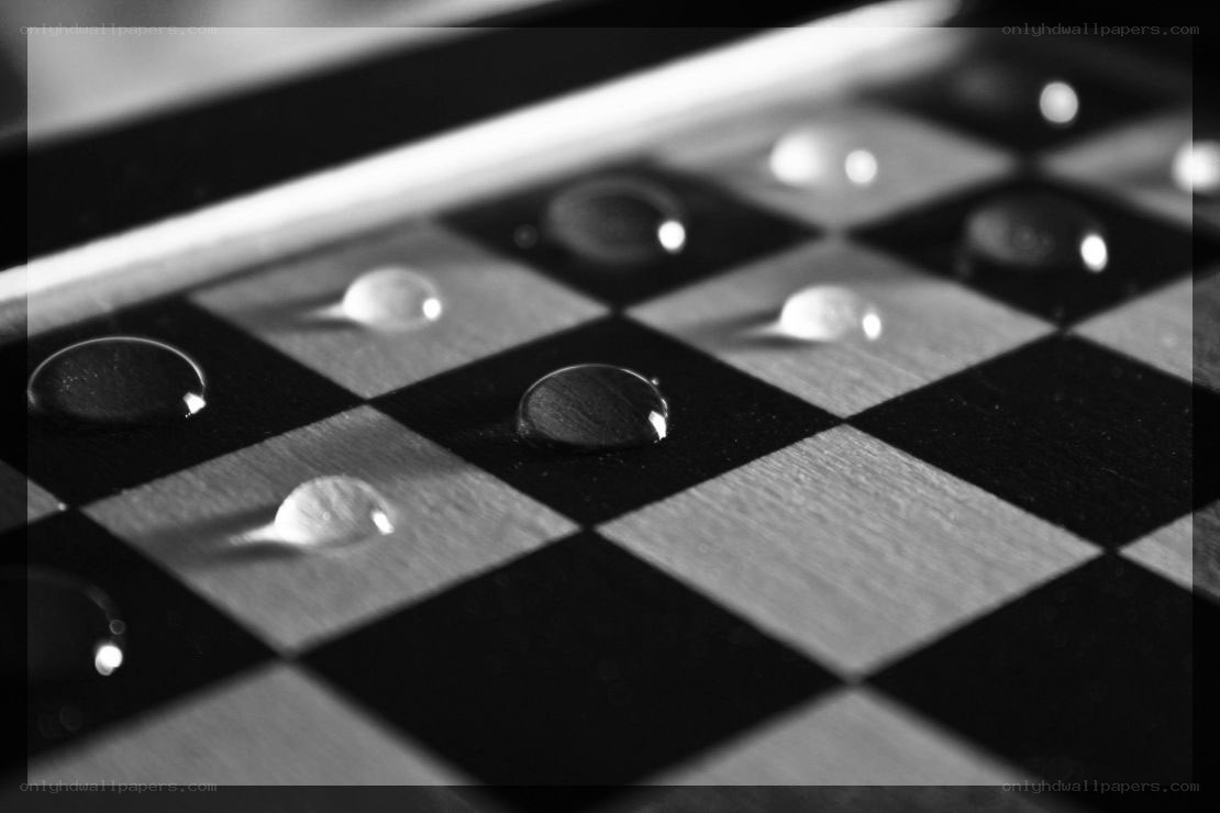 Water droplets on a chessboard