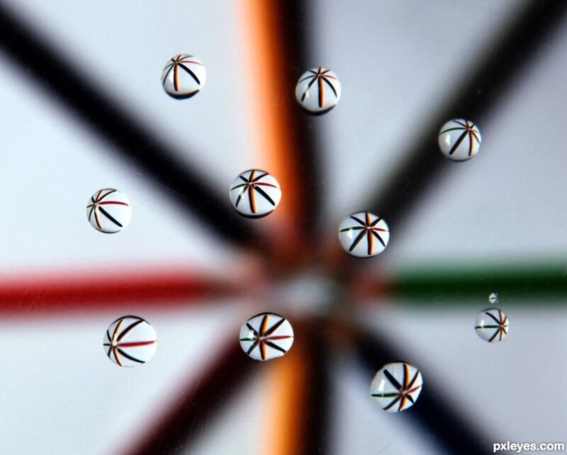 Water droplets on a colorful surface