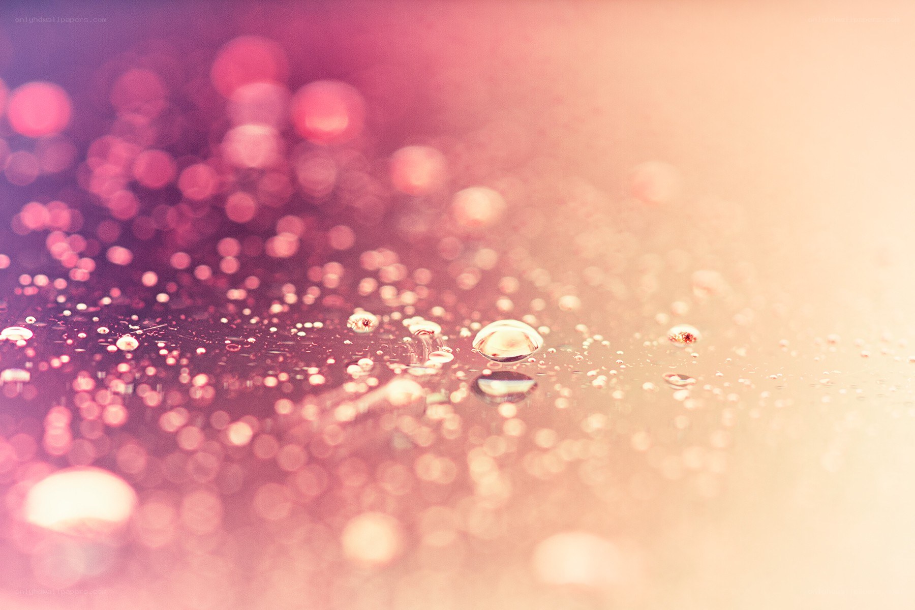 Water droplets on a colorful surface