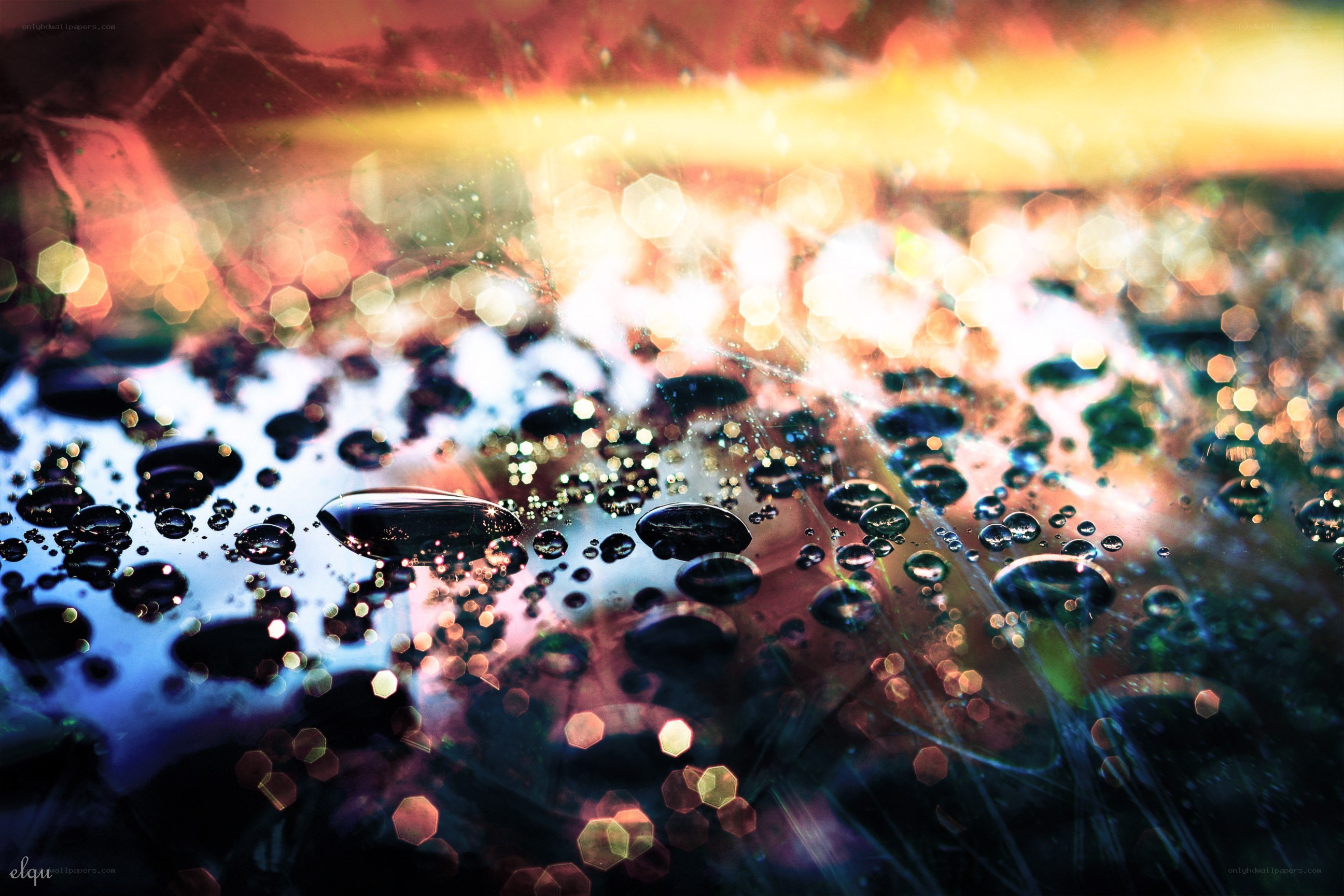 Water droplets on a colorful surface